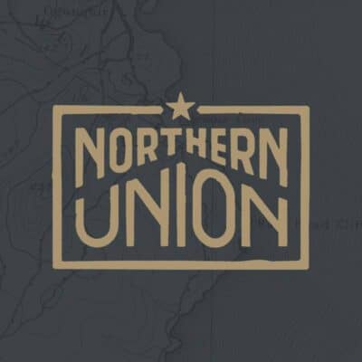 a gray square background with gold lettering that says Northern union with a star